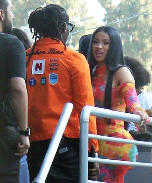 Cardi B boobs and booty on display on and off stage showing nice cleavage and her sexy ass in a tight dress.























