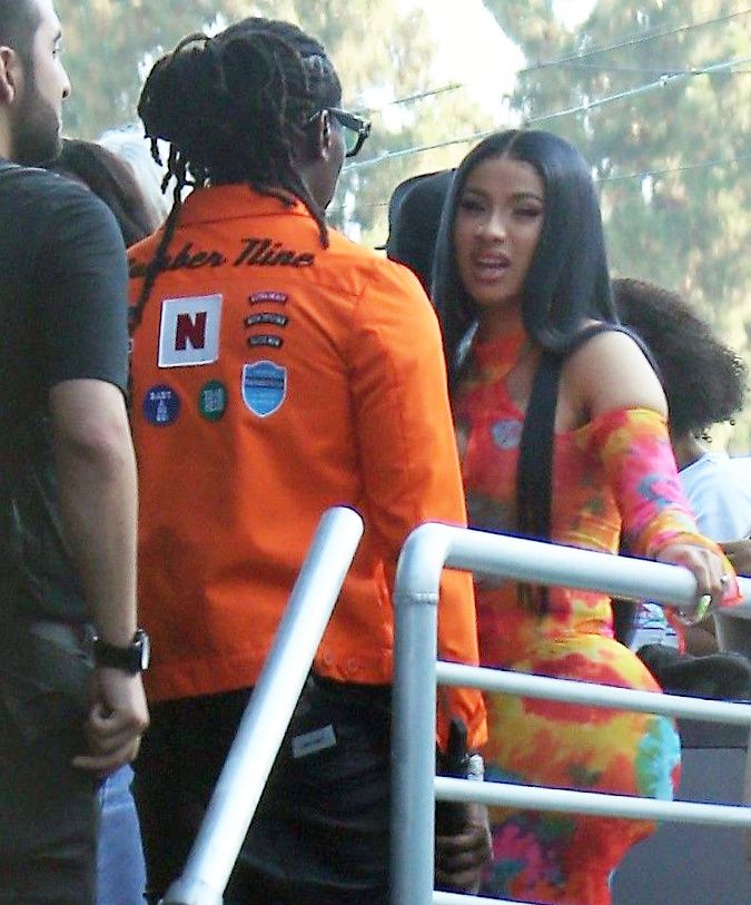 Cardi B boobs and booty on display on and off stage showing nice cleavage and her sexy ass in a tight dress.























