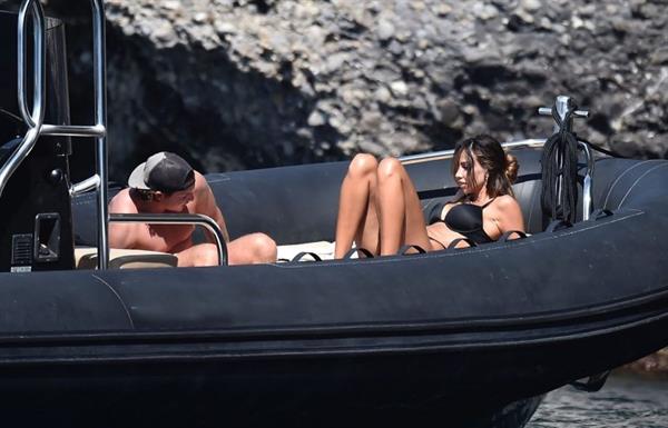 Madalina Diana Ghenea sexy ass and cleavage in a thong bikini seen by paparazzi.


