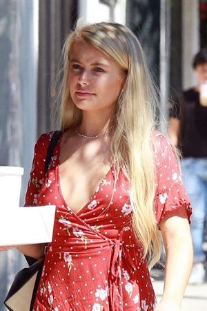 Demi Burnett braless boobs in a low cut dress showing nice cleavage seen by paparazzi.






