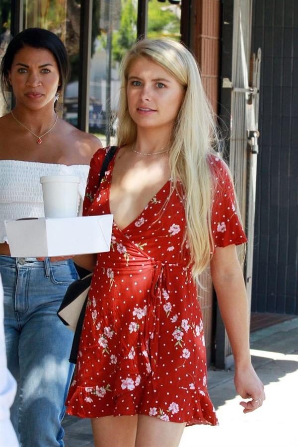 Demi Burnett braless boobs in a low cut dress showing nice cleavage seen by paparazzi.






