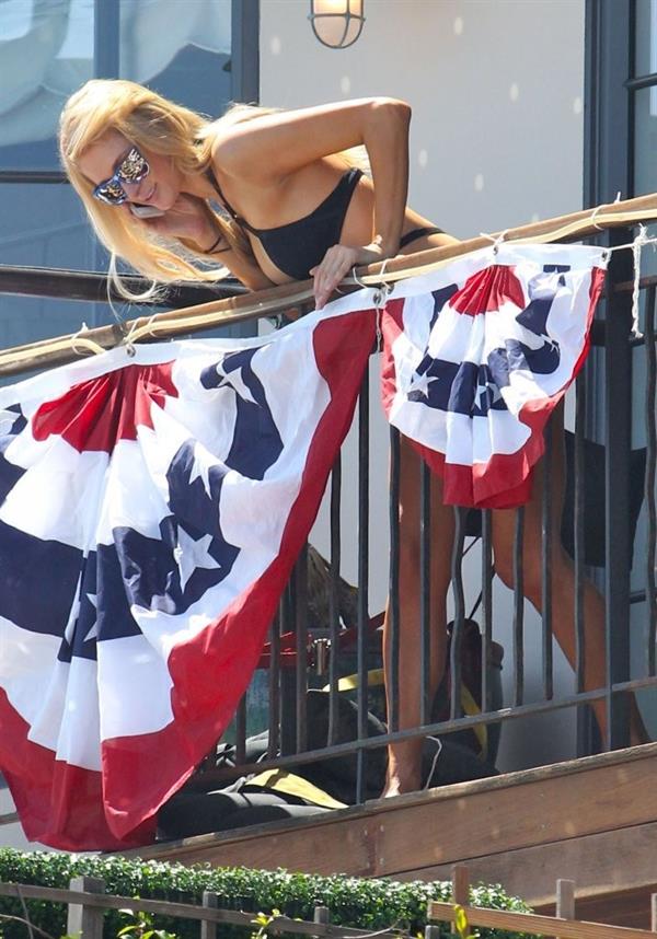 Paris Hilton on a balcony