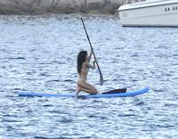 Rihanna paddle boarding