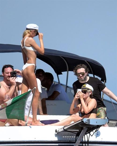Kristen Stewart Bikini Pictures Kristen Stewart and Stella Maxwell sexy lesbians making out on a boat in bikinis seen by paparazzi.