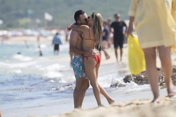 Sylvie Meis sexy ass in a bikini at the beach with her new boyfriend at the beach seen by paparazzi.















