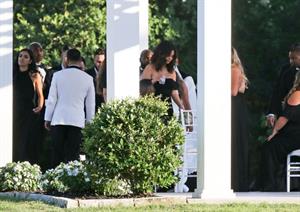 Selena Gomez sexy in a black dress for her cousins wedding showing nice cleavage seen by paparazzi.























