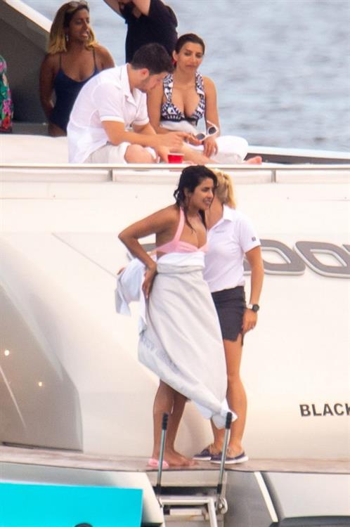 Priyanka Chopra Pictures Priyanka Chopra sexy ass in a bikini partying on a yacht seen by paparazzi.
