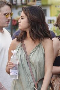 Selena Gomez braless and sexy in a dress seen by paparazzi in Rome.


