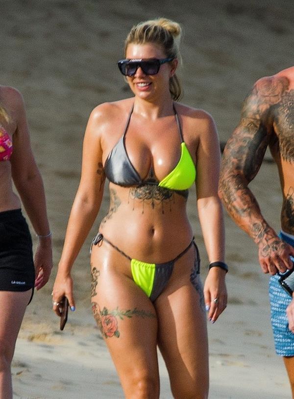 Olivia Buckland sexy in a bikini at the beach seen by paparazzi showing nice cleavage.



