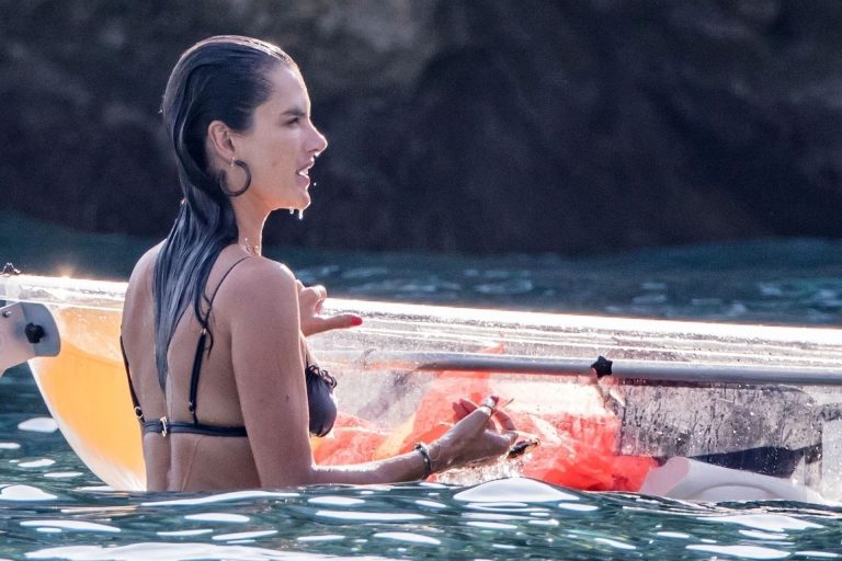 Alessandra Ambrosio Bikini Pictures Alessandra Ambrosio sexy at the beach in a thong bikini and flashing her pussy to her boyfriend seen by paparazzi.