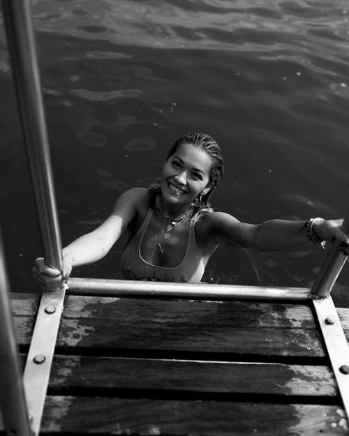 Rita Ora big tits in a wet swimsuit getting out of the water showing off her boobs.
































