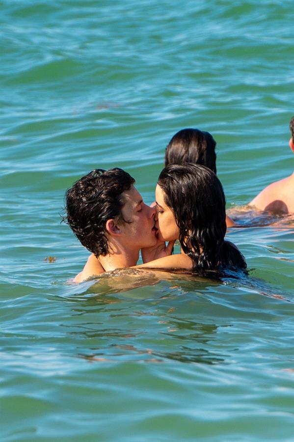 Camila Cabello and Shawn Mendes making out in the water seen by paparazzi kissing.





































