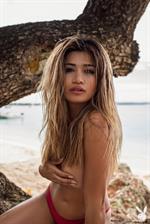 Nikki Trinidad takes off her red bikini for Playboy