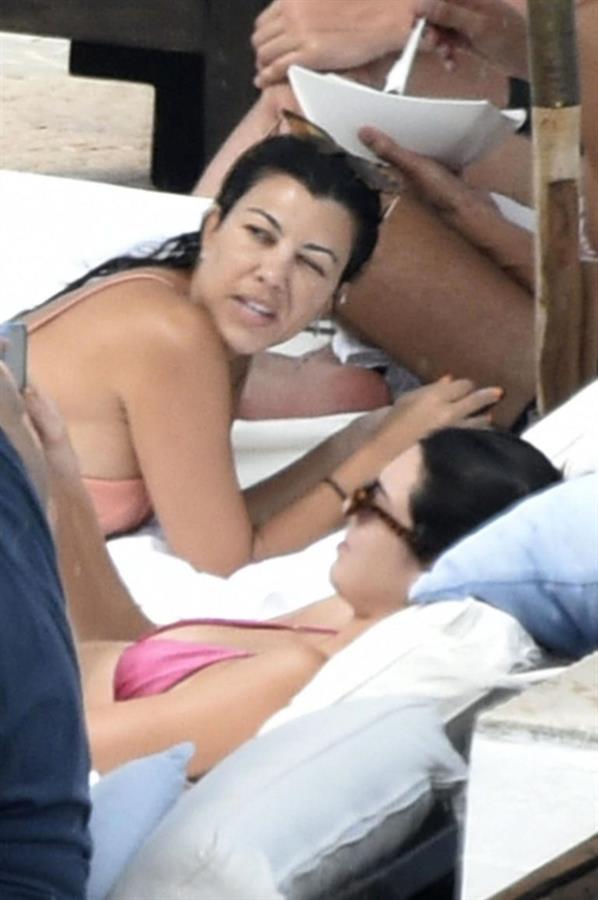 Kendall Jenner with Kourtney Kardashian sexy asses in thong bikinis seen by paparazzi.

