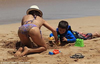 Sarah Shahi in a bikini - ass