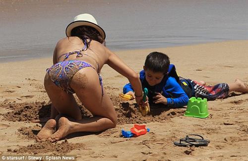 Sarah Shahi in a bikini - ass