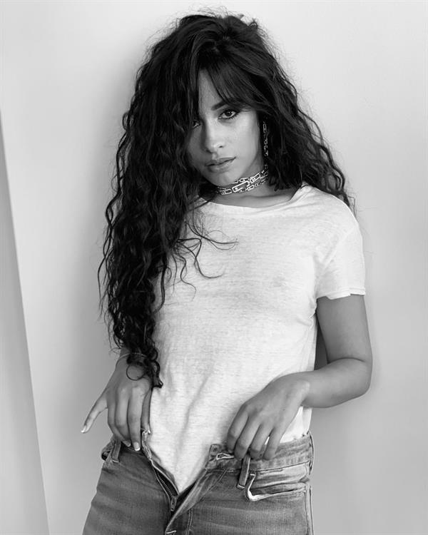 Camila Cabello braless boobs in a see through white top showing her tits.






