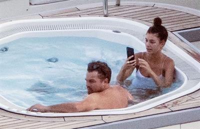 Camila Morrone in a sexy swimsuit in a hot tub on a yacht with Leonardo DiCaprio seen by paparazzi.










