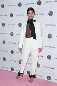 Priyanka Chopra braless boobs in a see through top showing some nice cleavage at Beautycon.

