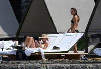 Miley Cyrus and Kaitlynn Carter making out kissing by the pool seen by paparazzi showing her lesbian side after leaving Liam Hemsworth.




