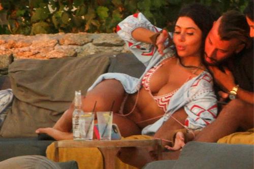 Martha Kalifatidis Bikini Pictures Martha Kalifatidis sexy in a bikini showing her ass and nice cleavage seen by paparazzi.