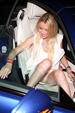 Tara Reid upskirt wardrobe malfunction flashing her panties getting in the car seen by paparazzi.

















