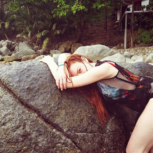 Lindsay Lohan Lingerie Pictures Lindsay Lohan side boob in a sexy fishnet outfit.