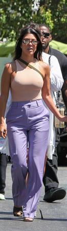 Kourtney Kardashian braless boobs in a nude tank top showing off her tits pokies with Kris Jenner seen by paparazzi.














