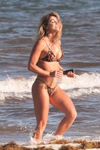 Aline Riscado seen at the beach by paparazzi in a sexy ass thong bikini showing nice cleavage.


