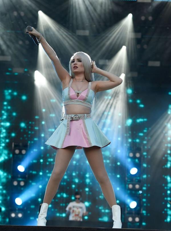 Kim Petras upskirt on stage singing and showing her panties.







