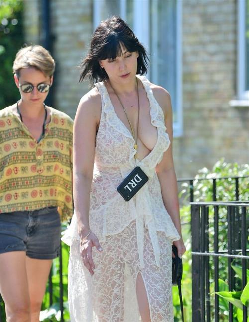 Daisy Lowe Pictures Daisy Lowe braless boobs in a see through dress showing off her tits and cleavage seen by paparazzi.