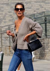 Katie Holmes sexy cleavage seen by paparazzi in a revealing outfit.

