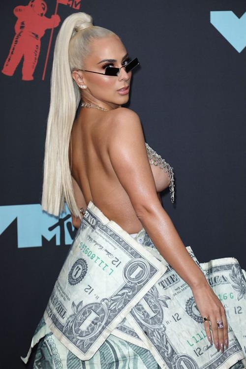 Veronica Vega Pictures Veronica Vega showing off her braless boobs on the red carpet at the MTV VMA's in a see through top.