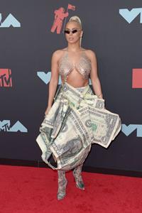 Veronica Vega showing off her braless boobs on the red carpet at the MTV VMA's in a see through top.














