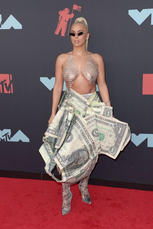 Veronica Vega Pictures Veronica Vega showing off her braless boobs on the red carpet at the MTV VMA's in a see through top.