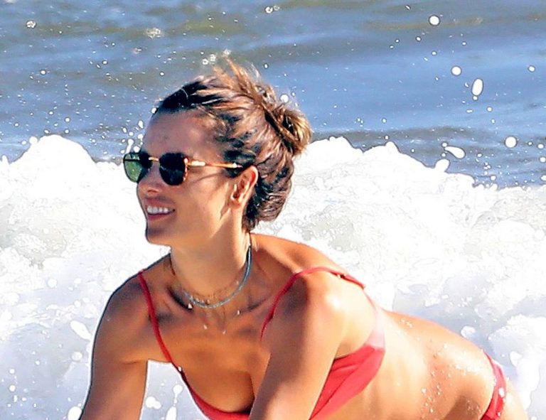 Alessandra Ambrosio Bikini Pictures Alessandra Ambrosio sexy ass and cleavage in a thong bikini seen at the beach by paparazzi.