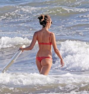 Alessandra Ambrosio sexy ass and cleavage in a thong bikini seen at the beach by paparazzi.





