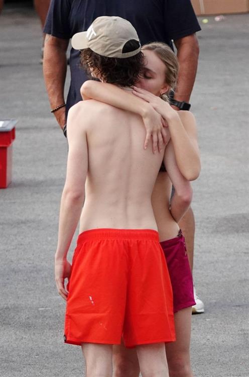 Lily-Rose Depp Pictures Lily-Rose Depp sexy ass in a little thong bikini making out with Timothee Chalamet on a boat seen by paparazzi.