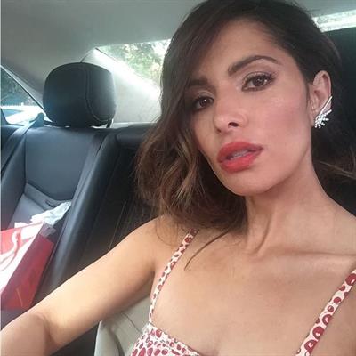 Sarah Shahi taking a selfie
