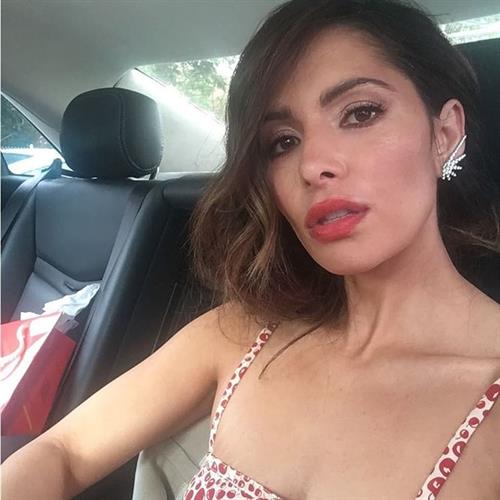 Sarah Shahi taking a selfie