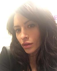 Sarah Shahi taking a selfie