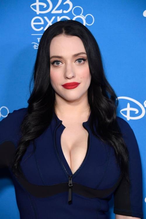Kat Dennings Pictures Kat Dennings famous big boobs showing nice cleavage in a tight blue dress.