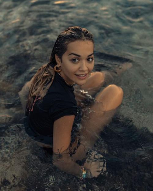 Rita Ora Pictures Rita Ora braless boobs in a wet t-shirt showing off her tits.