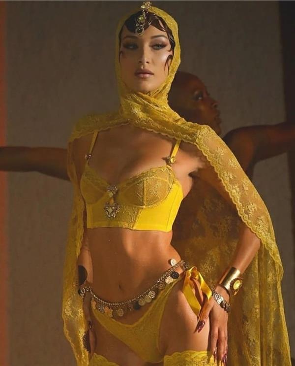 Bella Hadid sexy new yellow lingerie showing nice cleavage modelling bra and panties with stockings.






































































