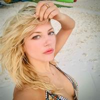 Katheryn Winnick in a bikini taking a selfie