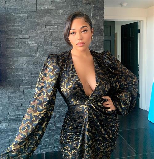 Jordyn Woods Pictures Jordyn Woods braless boobs showing nice cleavage in a low cut revealing outfit.