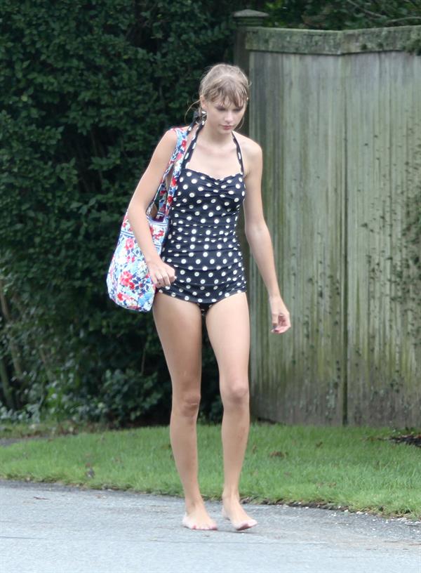 Taylor Swift wearing a bikini top and swimsuit in Hyannis on April 12, 2013