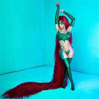 Cardi B sexy revealing Halloween costume dressed as Poison showing off her big tits and ass.

