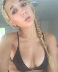Sam Jann in a bikini taking a selfie