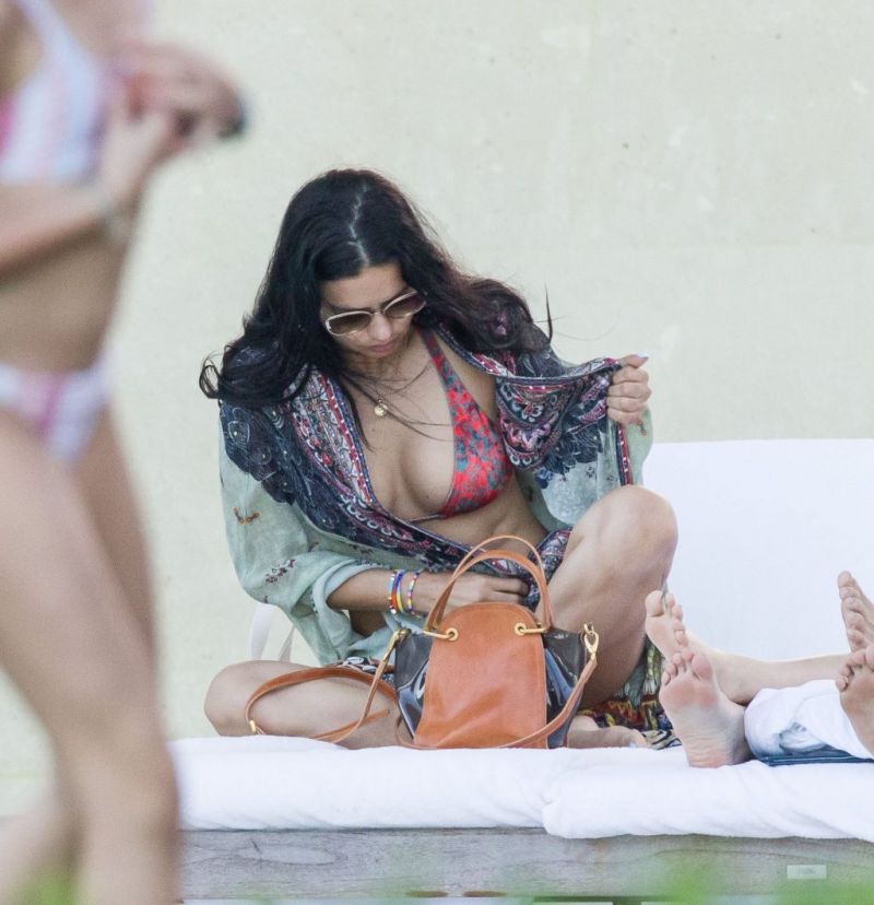 Adriana Lima Pictures Adriana Lima in a sexy bikini showing nice cleavage with her big tits and ass seen by paparazzi in Miami.
